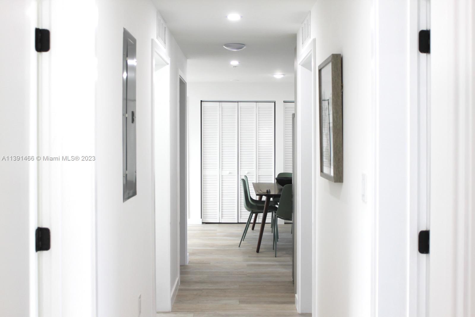 542 Southwest 7th Street Miami, FL 33130 - Photo 22 of 22 a view of a hallway with furniture and a window