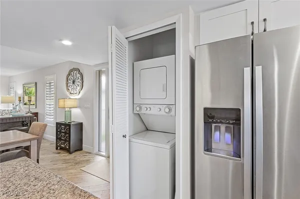 a view of a hallway with entryway dining room and livingroom view