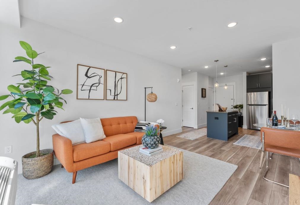 54 Flagship Street, Unit 421 Bayonne, NJ 07002 - Photo 1 of 16 a living room with furniture potted plant and a table