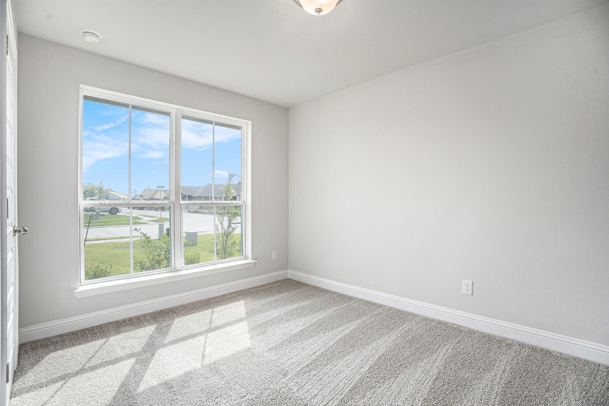 424 Bryan Street Angleton, TX 77515 - Photo 12 of 17 a view of an empty room with a window