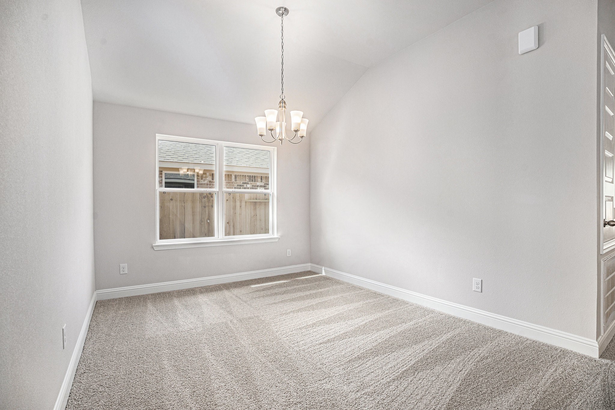 424 Bryan Street Angleton, TX 77515 - Photo 4 of 17 a view of an empty room with a window