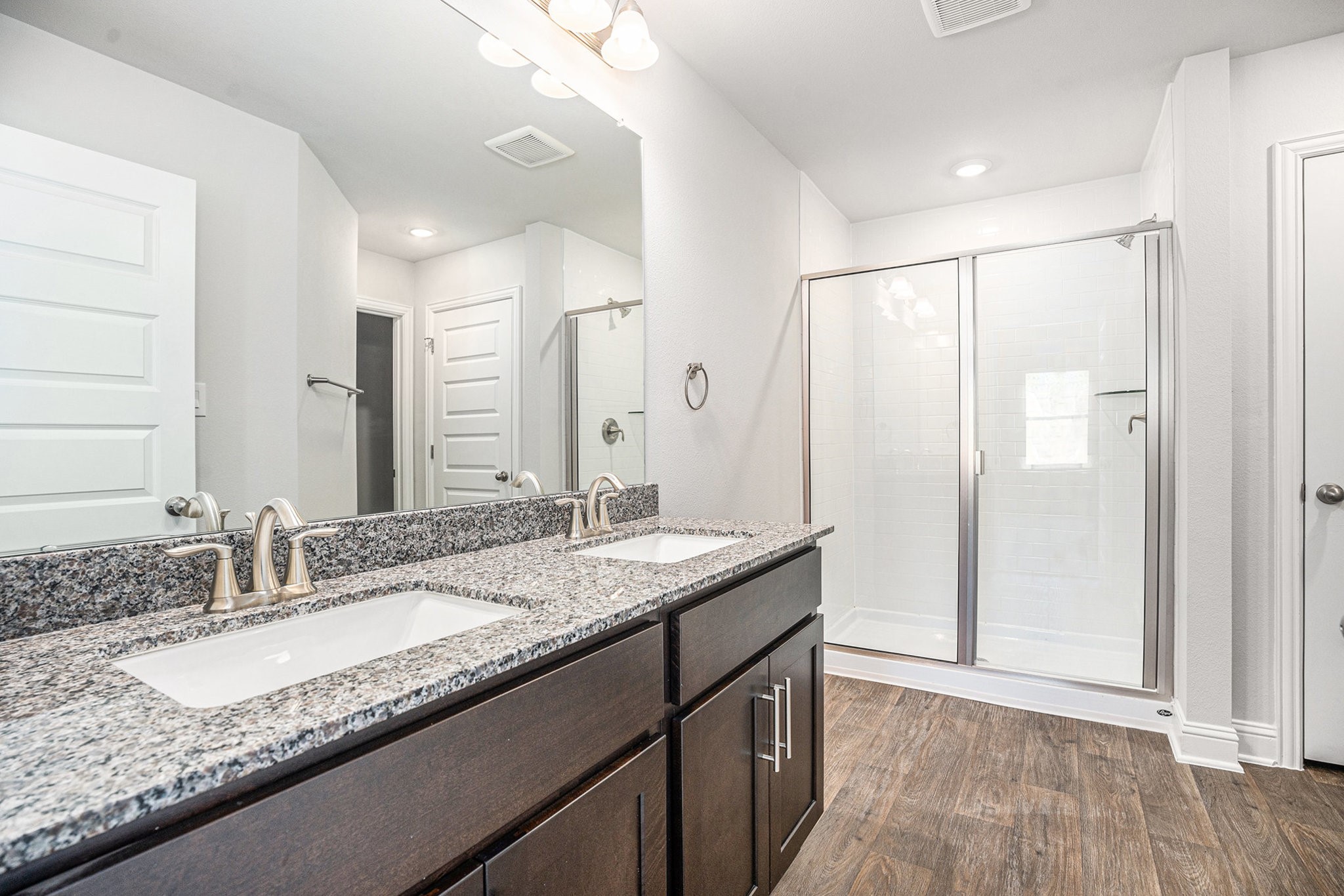 424 Bryan Street Angleton, TX 77515 - Photo 8 of 17 a bathroom with a granite countertop sink and a mirror