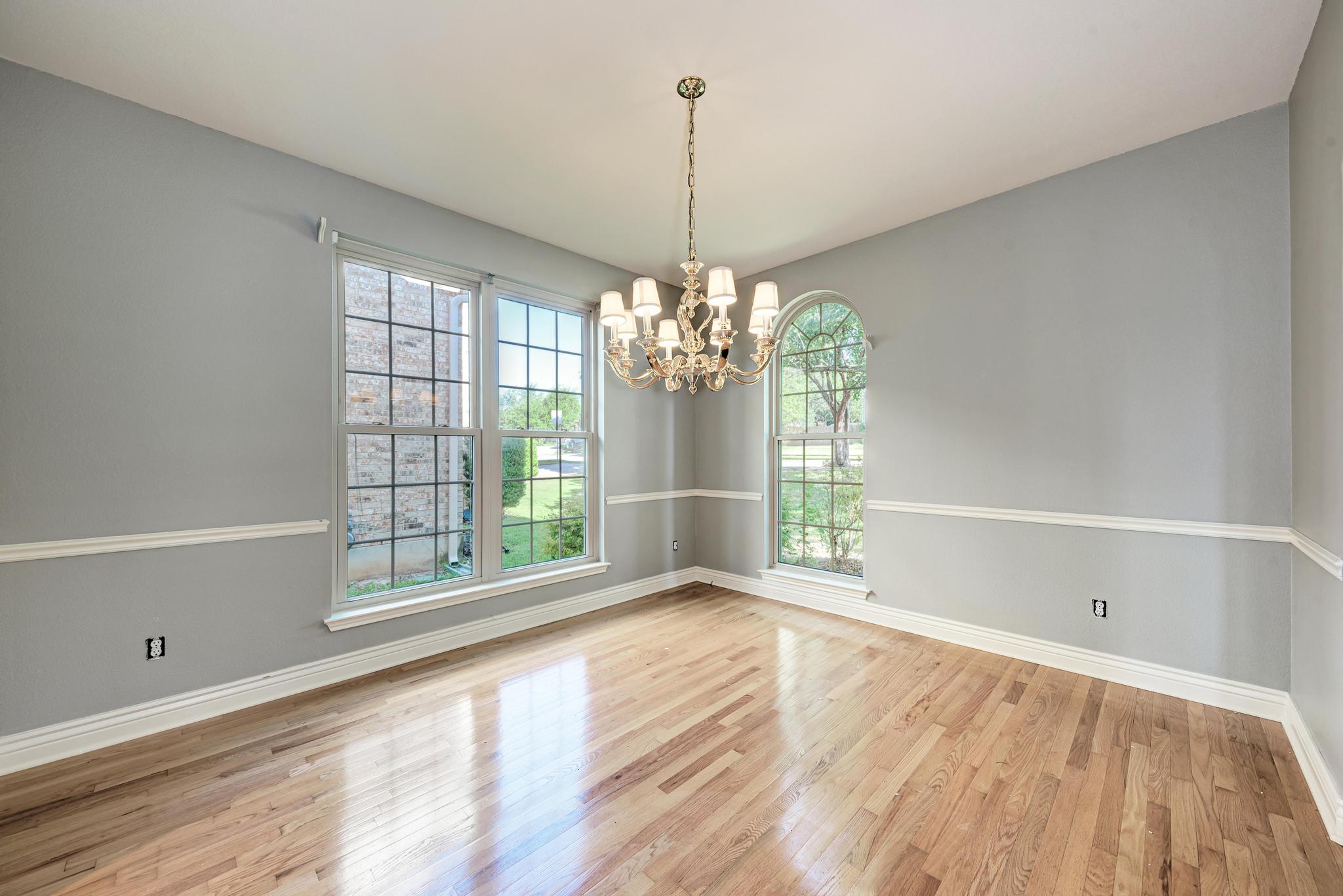 906 Antelope Ridge Cedar Park, TX 78613 - Photo 8 of 40 Polished hardwood floors and classic crown molding accent this versatile dining space.