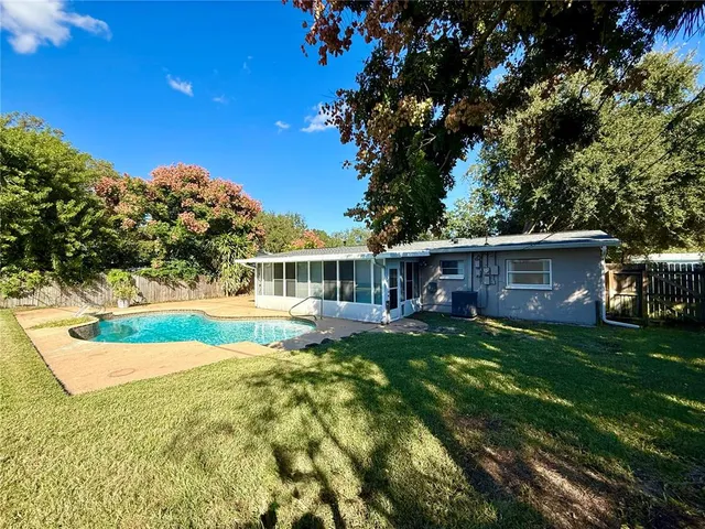 a view of house with outdoor space and garden