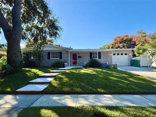 front view of a house with a yard