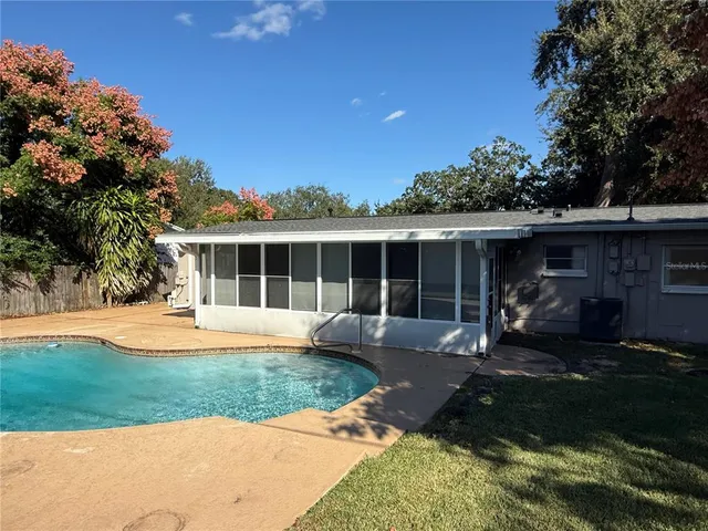 a front view of house with yard and outdoor seating