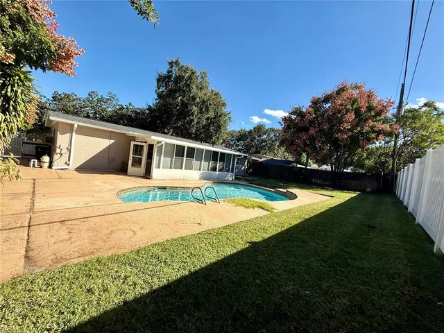 a view of a house with swimming pool