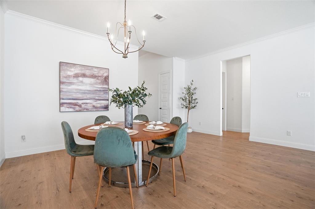 513 Fieldstone Lane Haslet, TX 76052 - Photo 15 of 39 a view of a dining room with furniture and chandelier