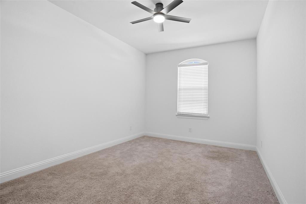 513 Fieldstone Lane Haslet, TX 76052 - Photo 29 of 39 an empty room with a window and a fan