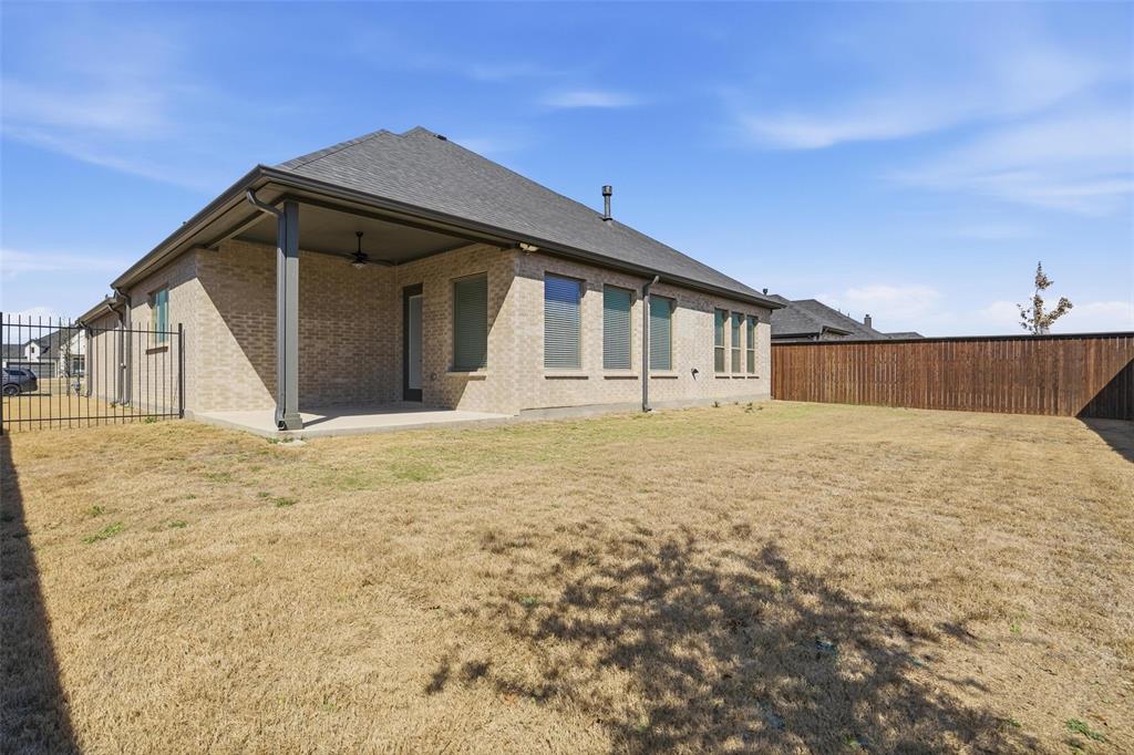 513 Fieldstone Lane Haslet, TX 76052 - Photo 33 of 39 a front view of a house with a yard