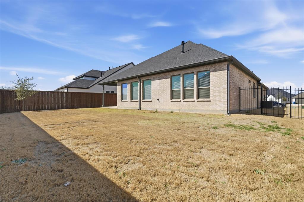 513 Fieldstone Lane Haslet, TX 76052 - Photo 35 of 39 a front view of a house with a yard