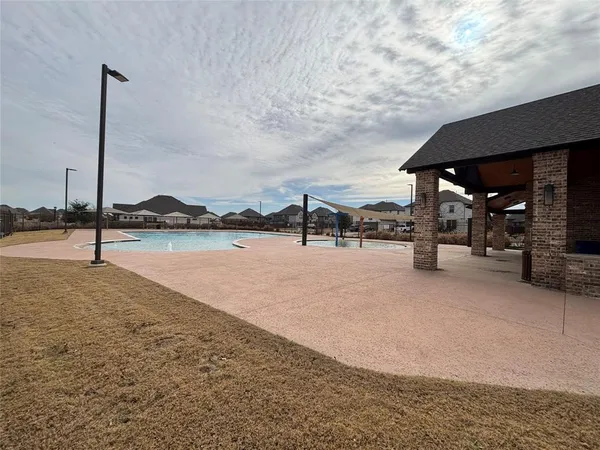 a view of multiple houses with a street