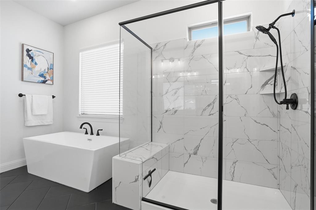 513 Fieldstone Lane Haslet, TX 76052 - Photo 8 of 39 a bathroom with a bathtub and shower