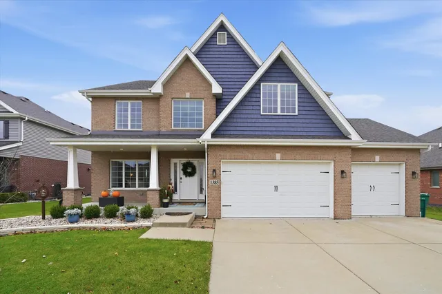 a view of a house with a yard and plants
