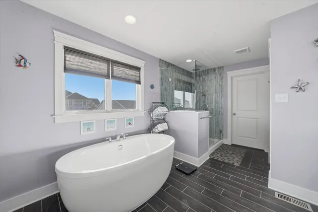 a white bath tub sitting next to a white sink