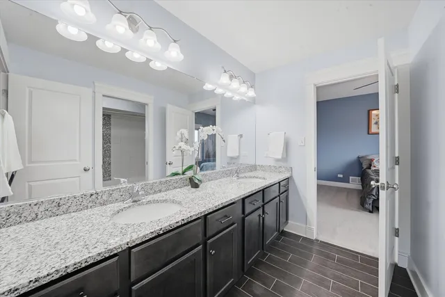 a bathroom with a sink double vanity and a mirror
