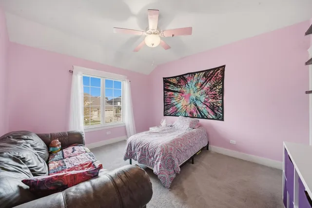 a bedroom with furniture and a window