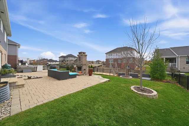 a view of a house with a yard porch and sitting area