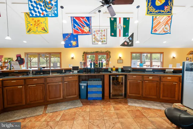 a kitchen with stainless steel appliances granite countertop a stove and cabinets