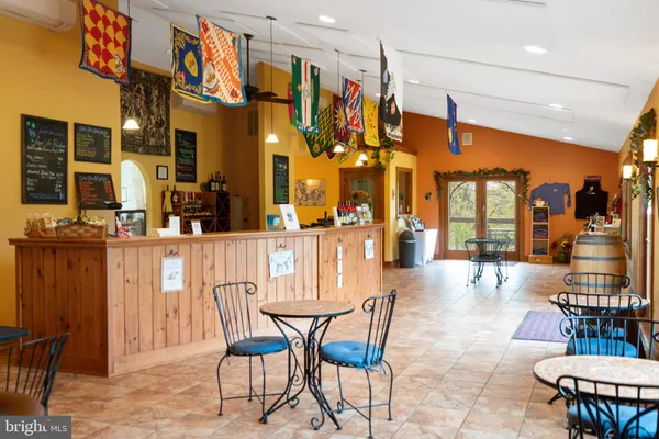a bedroom with two beds and a painting on the wall