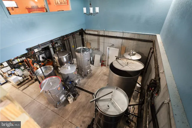 a view of a porch with a table and chairs