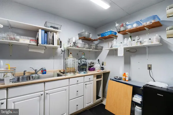 a view of a lake with a floor to ceiling window next to a yard