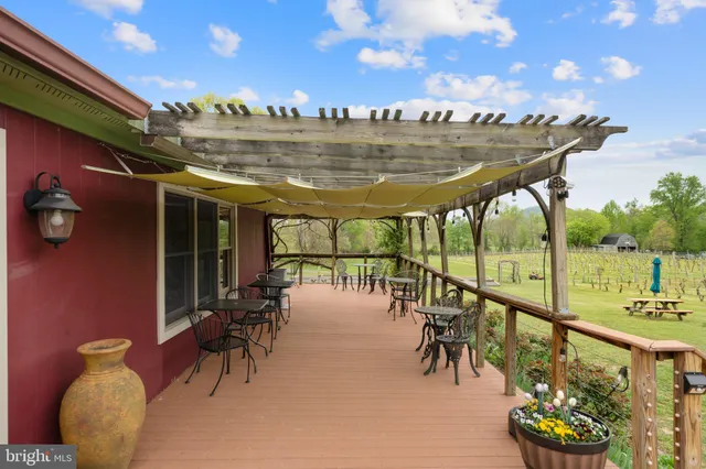 a swimming pool with outdoor seating and yard