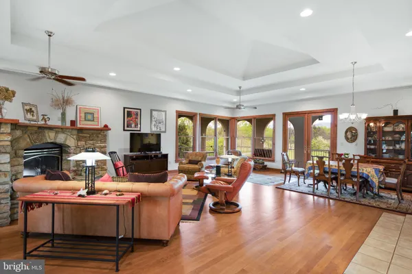 a living room with lots of furniture and a flat screen tv
