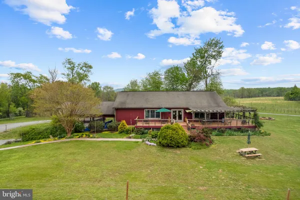 a aerial view of a house with garden space and street view