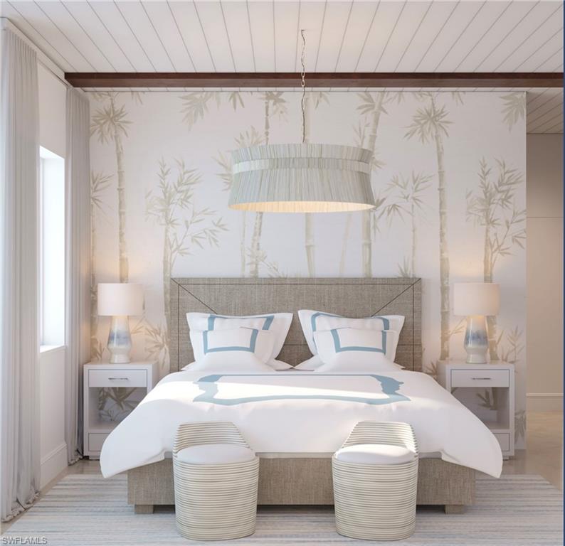 180 9th Street South, Unit 201 Naples, FL 34102 - Photo 3 of 5 a bedroom with a bed and a night stand