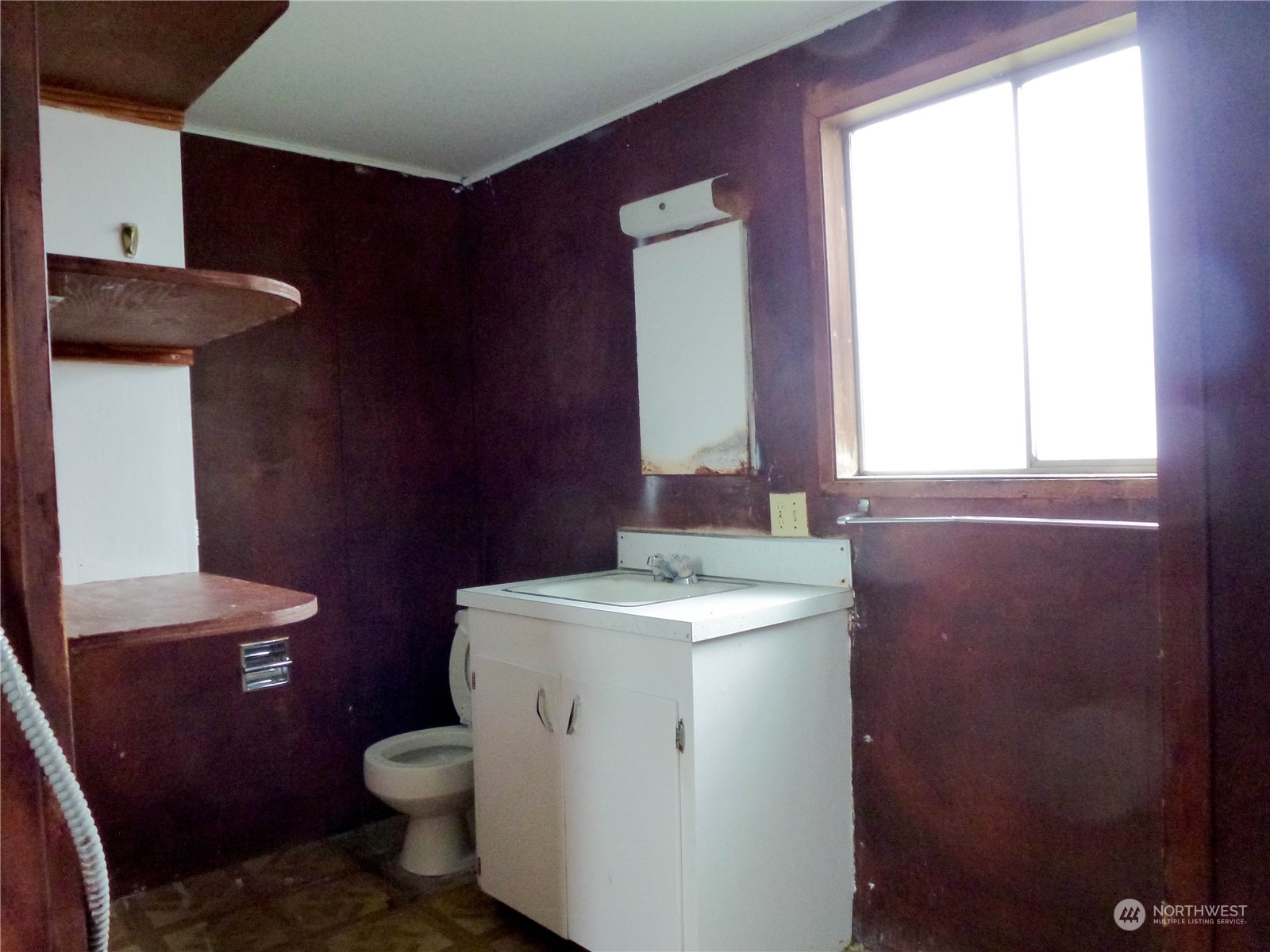 17096 Fir Island Road Mount Vernon, WA 98273 - Photo 11 of 22 a bathroom with a sink a toilet and a mirror