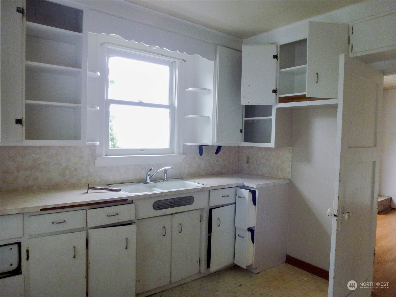 17096 Fir Island Road Mount Vernon, WA 98273 - Photo 12 of 22 a kitchen with a sink cabinets appliances and a window