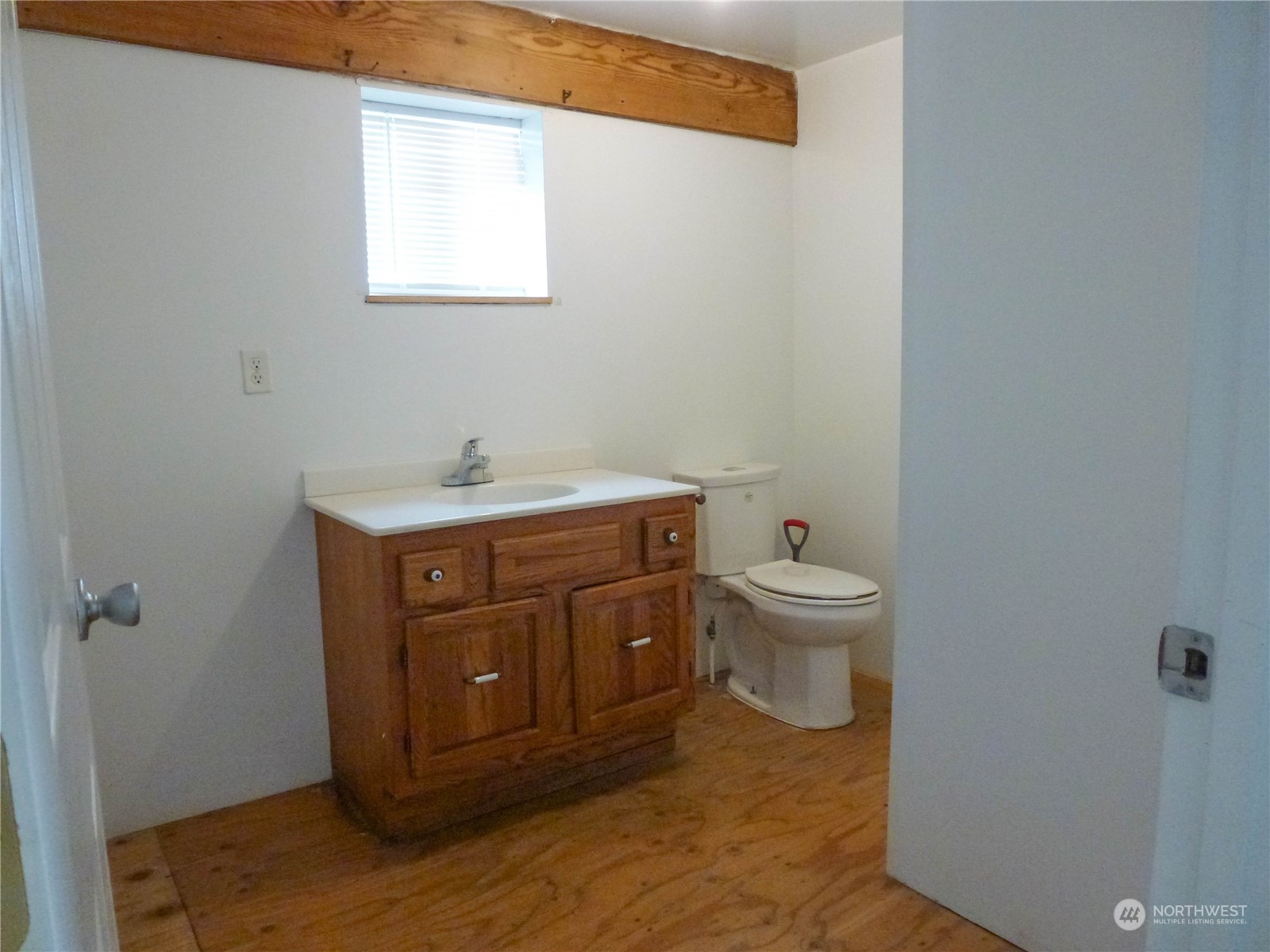 17096 Fir Island Road Mount Vernon, WA 98273 - Photo 18 of 22 a bathroom with a sink a toilet and a window