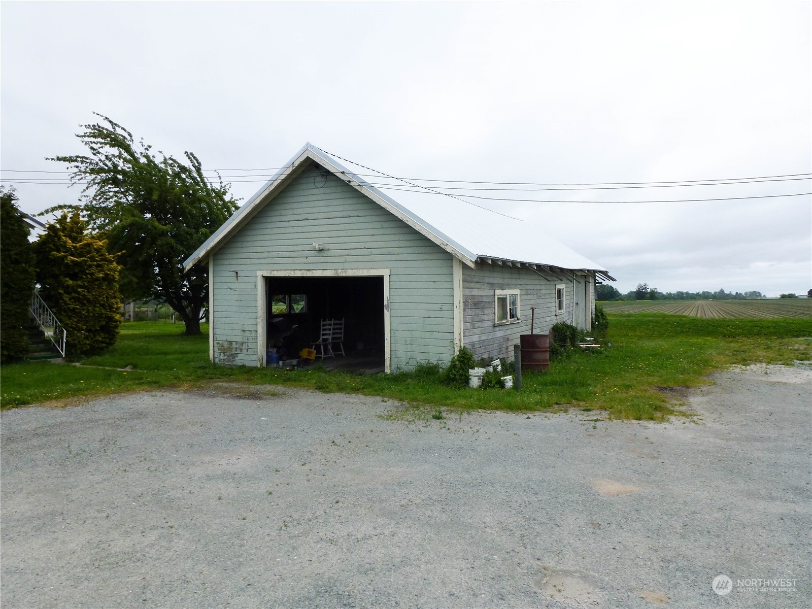 17096 Fir Island Road Mount Vernon, WA 98273 - Photo 4 of 22 a view of a house with backyard and garden