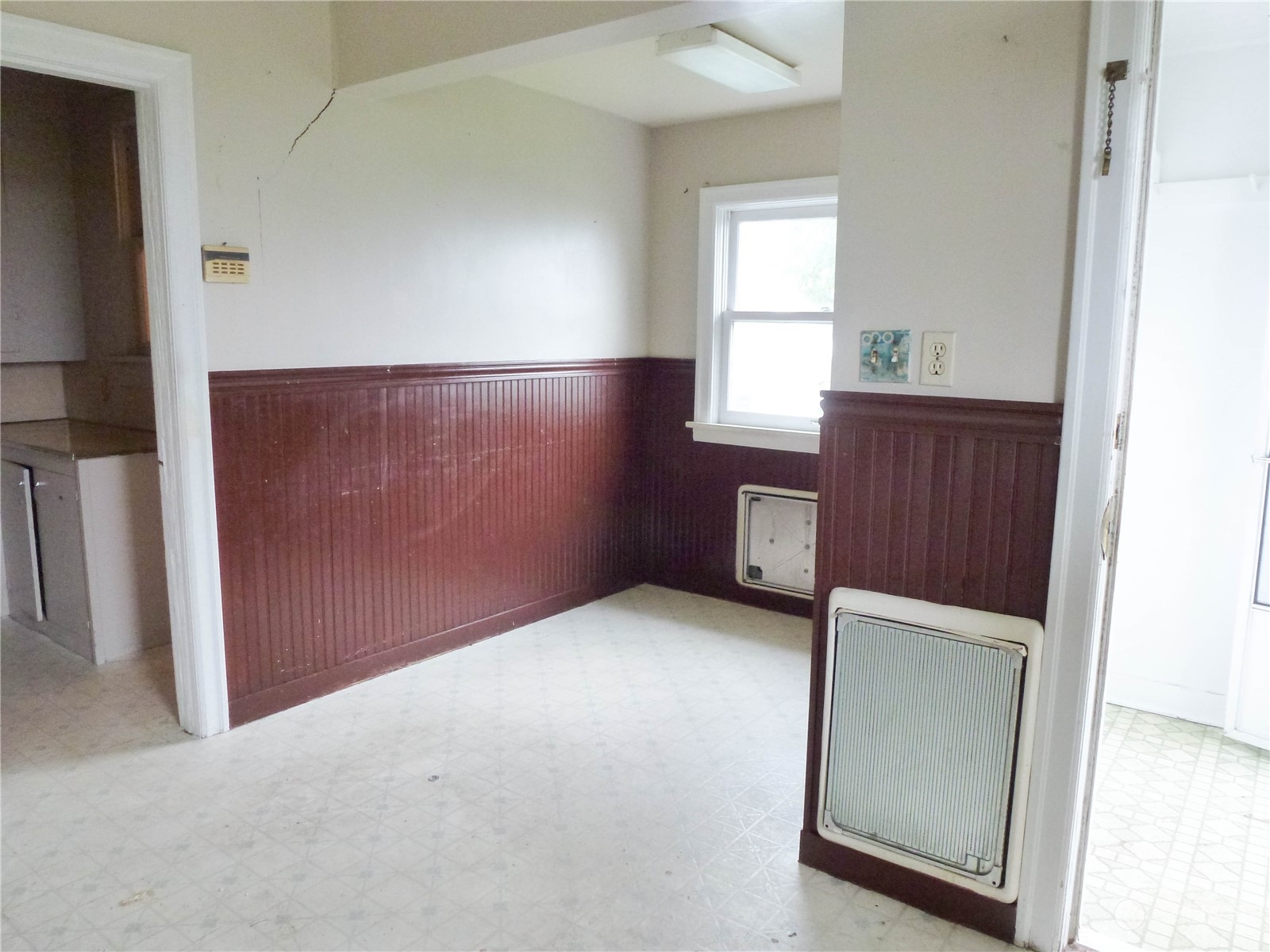 17096 Fir Island Road Mount Vernon, WA 98273 - Photo 9 of 22 an empty room with windows and cabinet