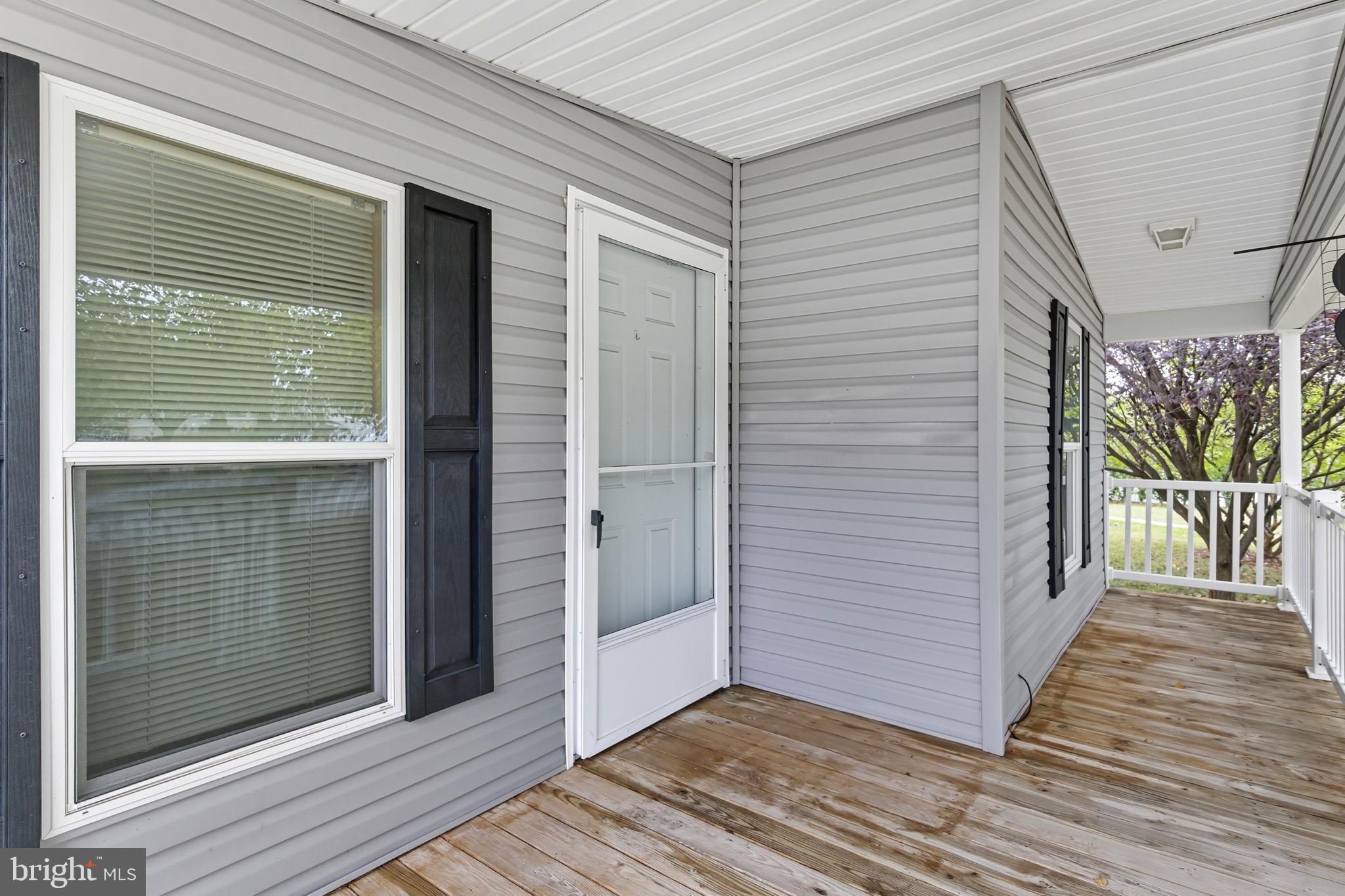 800 York Road, Unit 290 Dover, PA 17315 - Photo 6 of 23 a view of a balcony with wooden floor