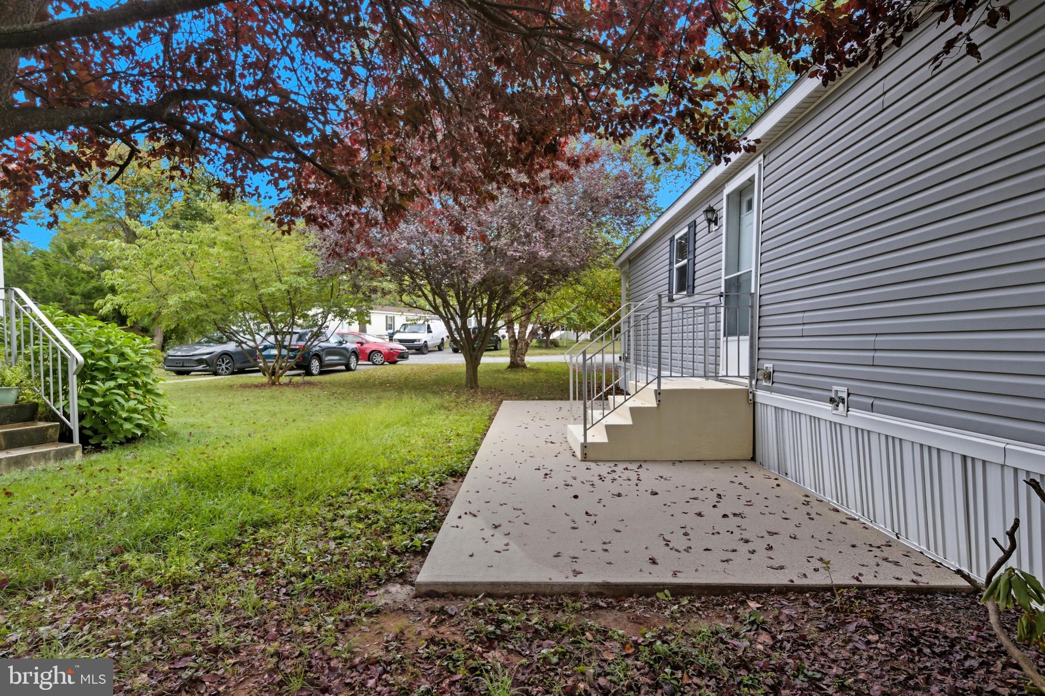 800 York Road, Unit 290 Dover, PA 17315 - Photo 8 of 23 a view of a yard with plants and tree