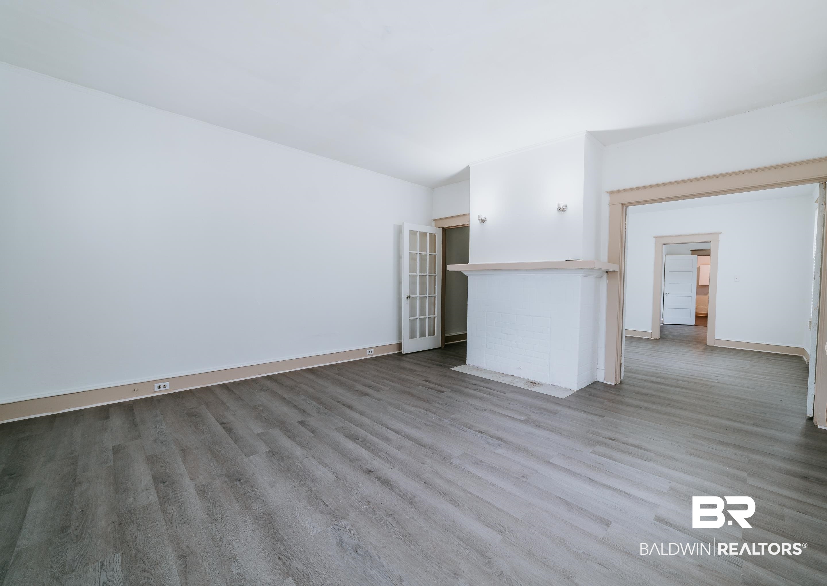 5 North Fulton Street Mobile, AL 36607 - Photo 28 of 55 Unfurnished living room with hardwood / wood-style flooring