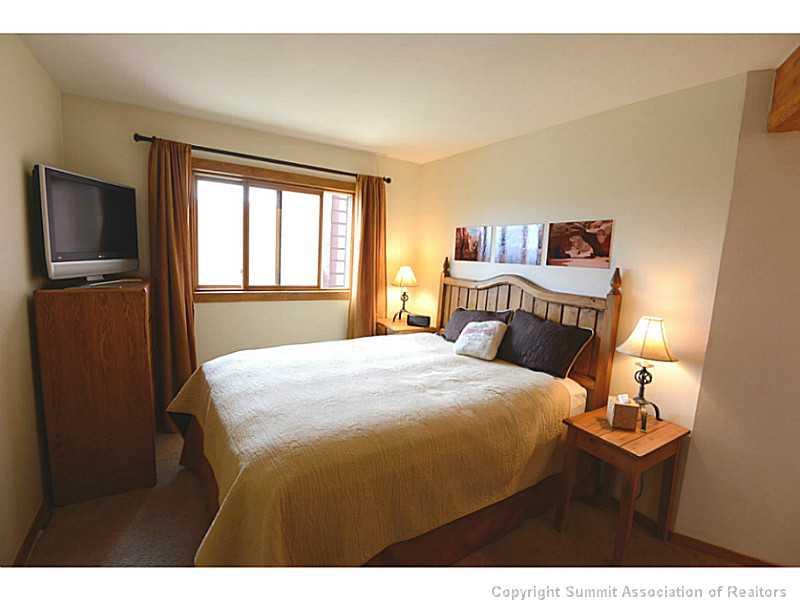 9460 Ryan Gulch Road, Unit 82 Silverthorne, CO 80498 - Photo 16 of 25 Master Bedroom. Master bedroom with mountain views.