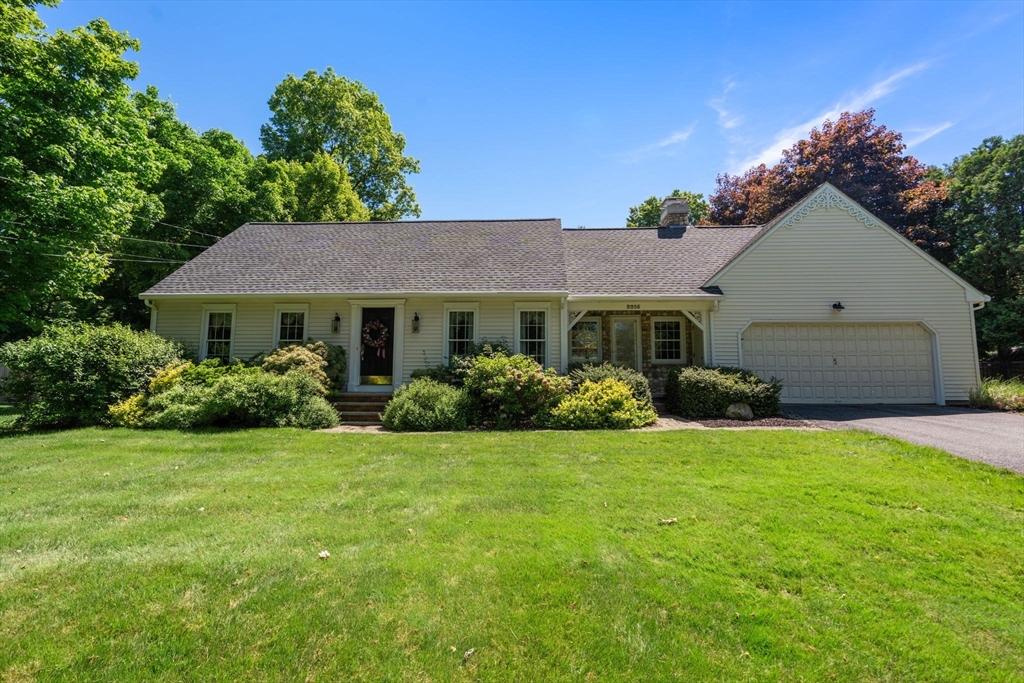 2035 Parker Street Springfield, MA 01128 - Photo 1 of 42 a front view of a house with a garden and yard