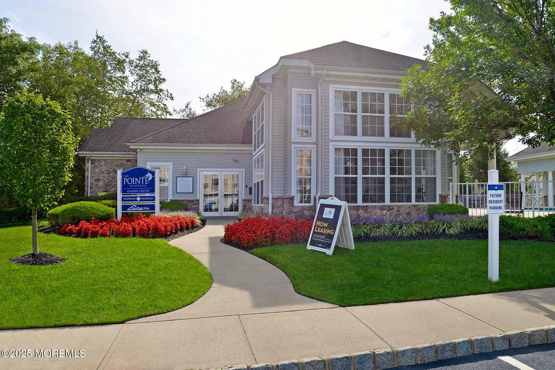 435 Timber Ridge Court Neptune Township, NJ 07753 - Photo 20 of 26 a front view of a house with a yard and green space