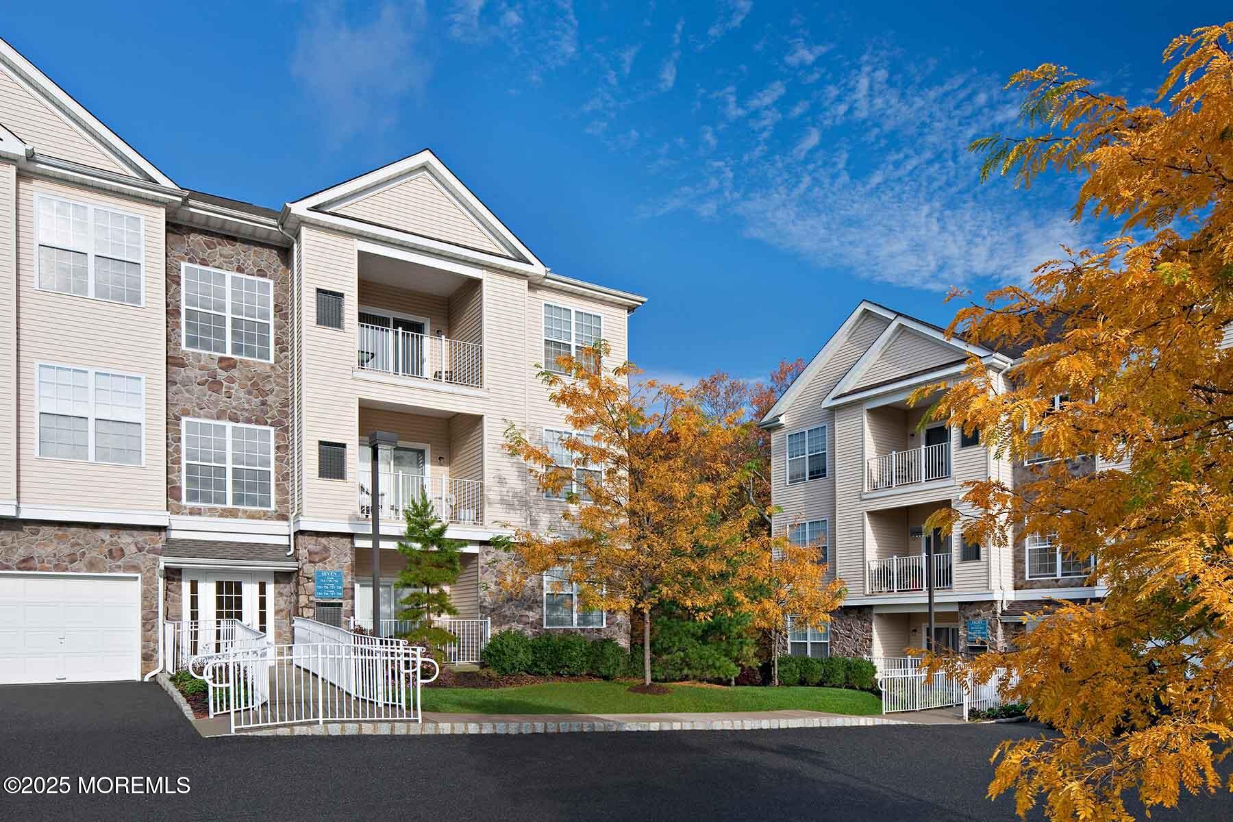 435 Timber Ridge Court Neptune Township, NJ 07753 - Photo 24 of 26 a front view of a house with a yard