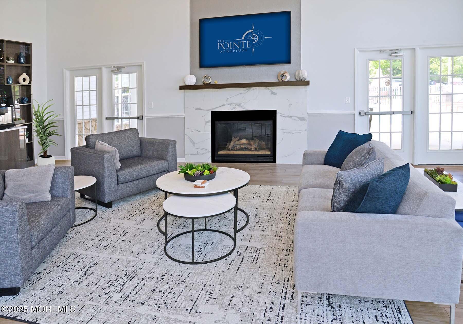 435 Timber Ridge Court Neptune Township, NJ 07753 - Photo 3 of 26 a living room with furniture a fireplace a table and a large window