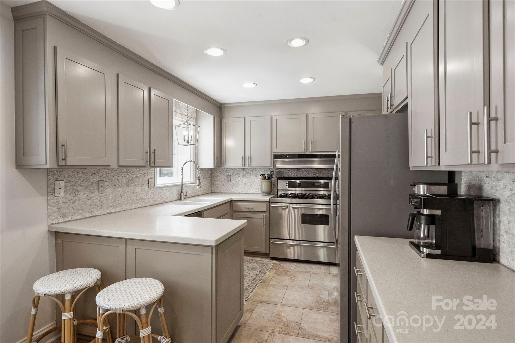 4115 Sulkirk Road Charlotte, NC 28210 - Photo 13 of 39 a kitchen with cabinets and chairs