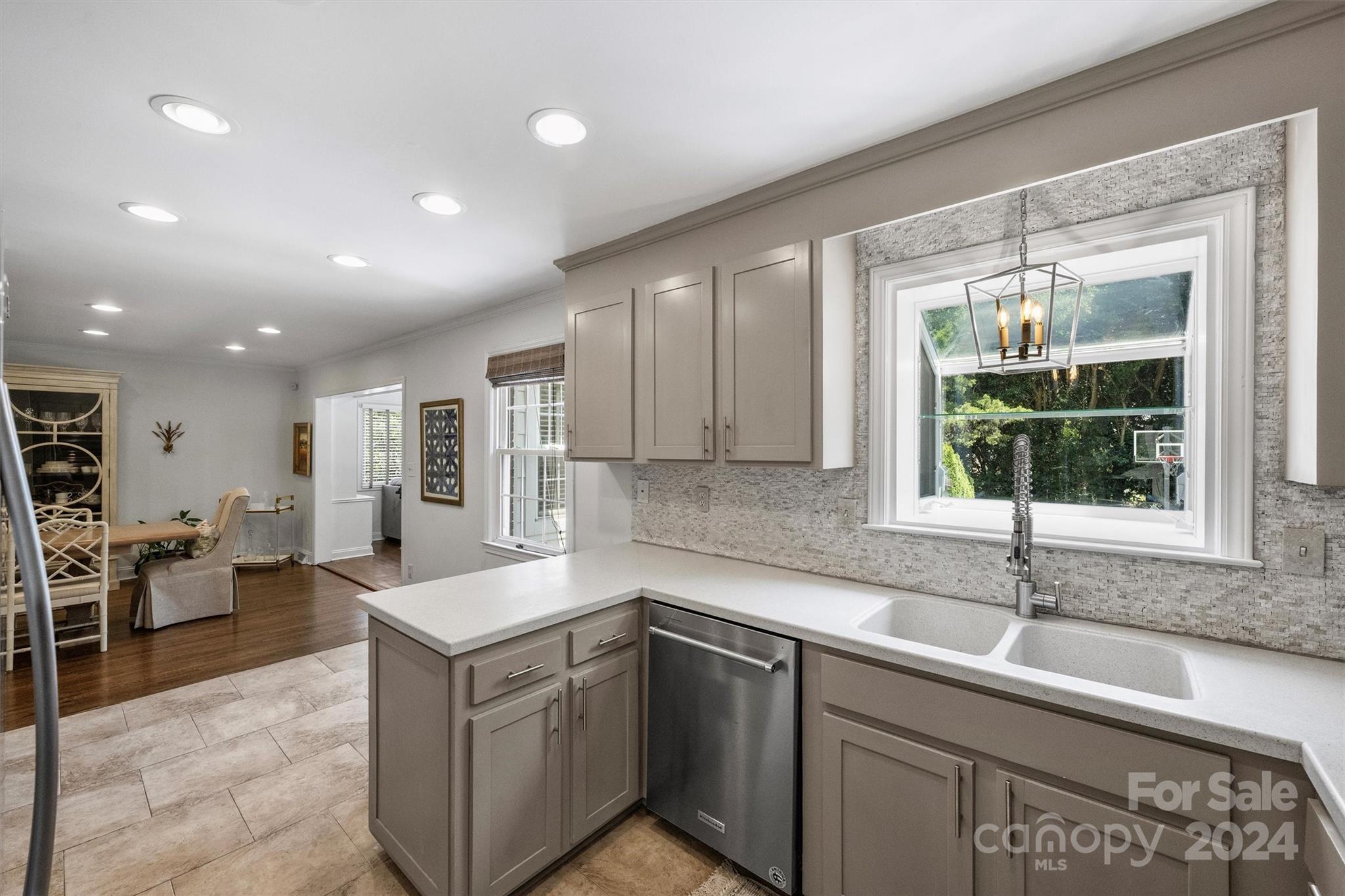 4115 Sulkirk Road Charlotte, NC 28210 - Photo 14 of 39 a kitchen that has a sink and a stove in it