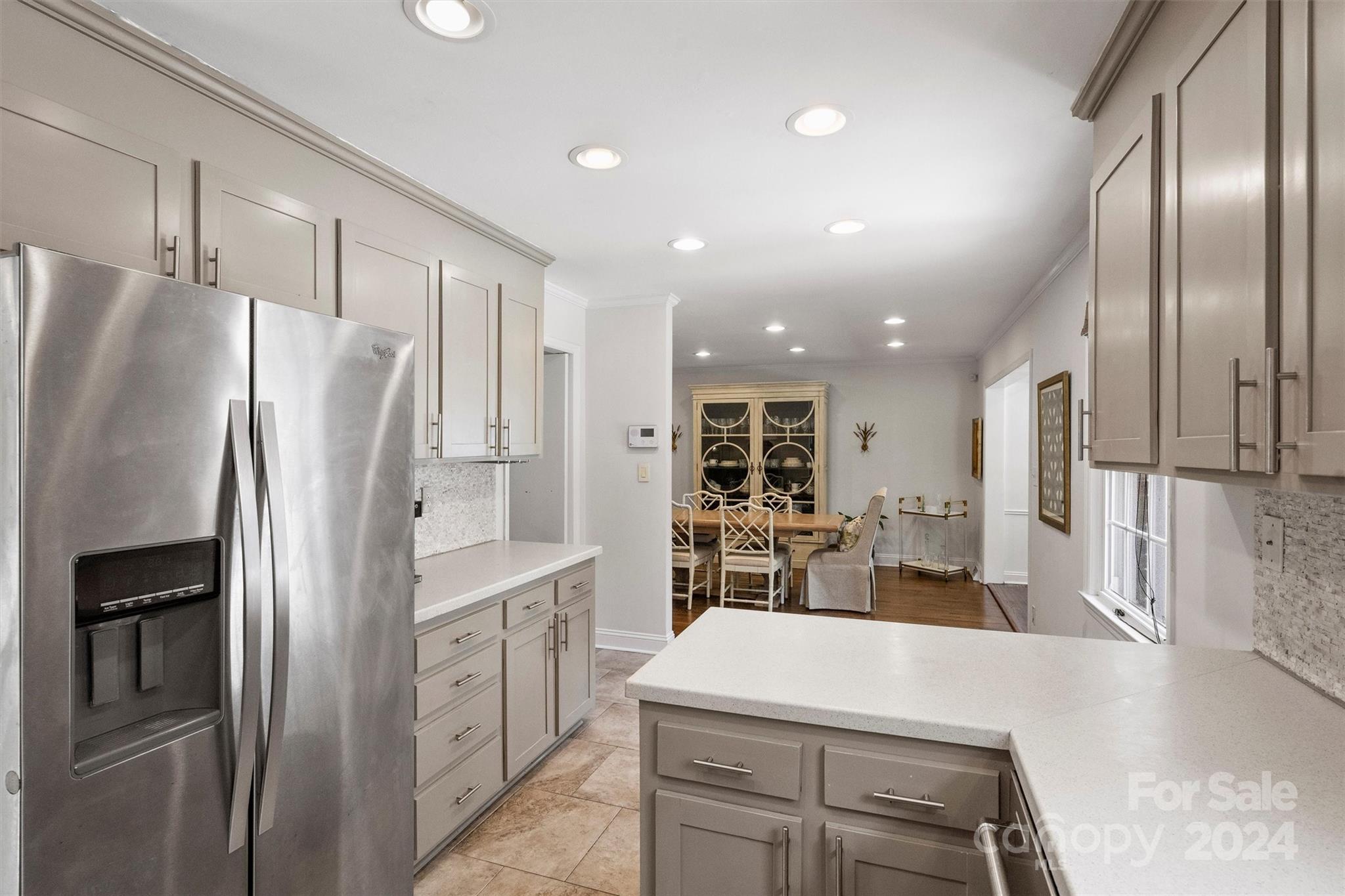 4115 Sulkirk Road Charlotte, NC 28210 - Photo 15 of 39 a kitchen with stainless steel appliances a refrigerator sink and stove