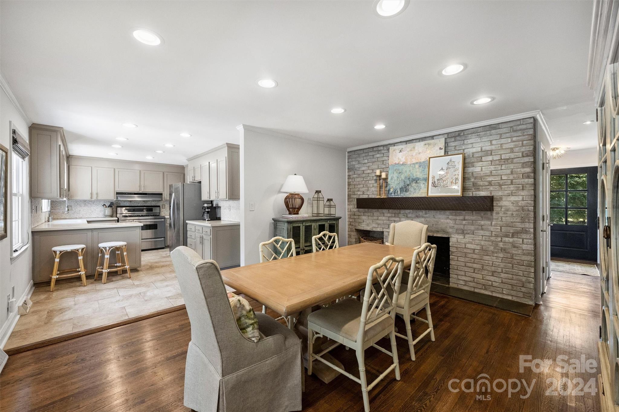 4115 Sulkirk Road Charlotte, NC 28210 - Photo 18 of 39 a view of a dining room with furniture and wooden floor