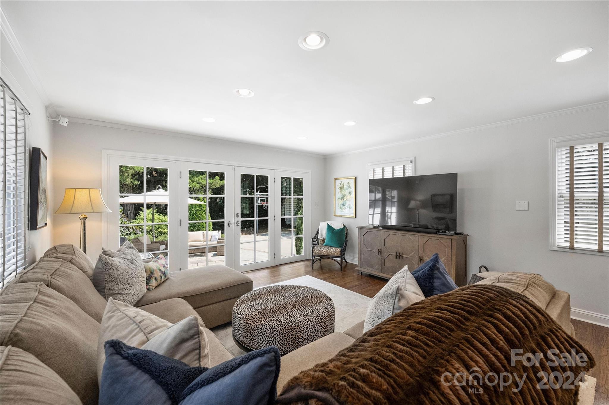 4115 Sulkirk Road Charlotte, NC 28210 - Photo 19 of 39 a bedroom with furniture and a flat screen tv