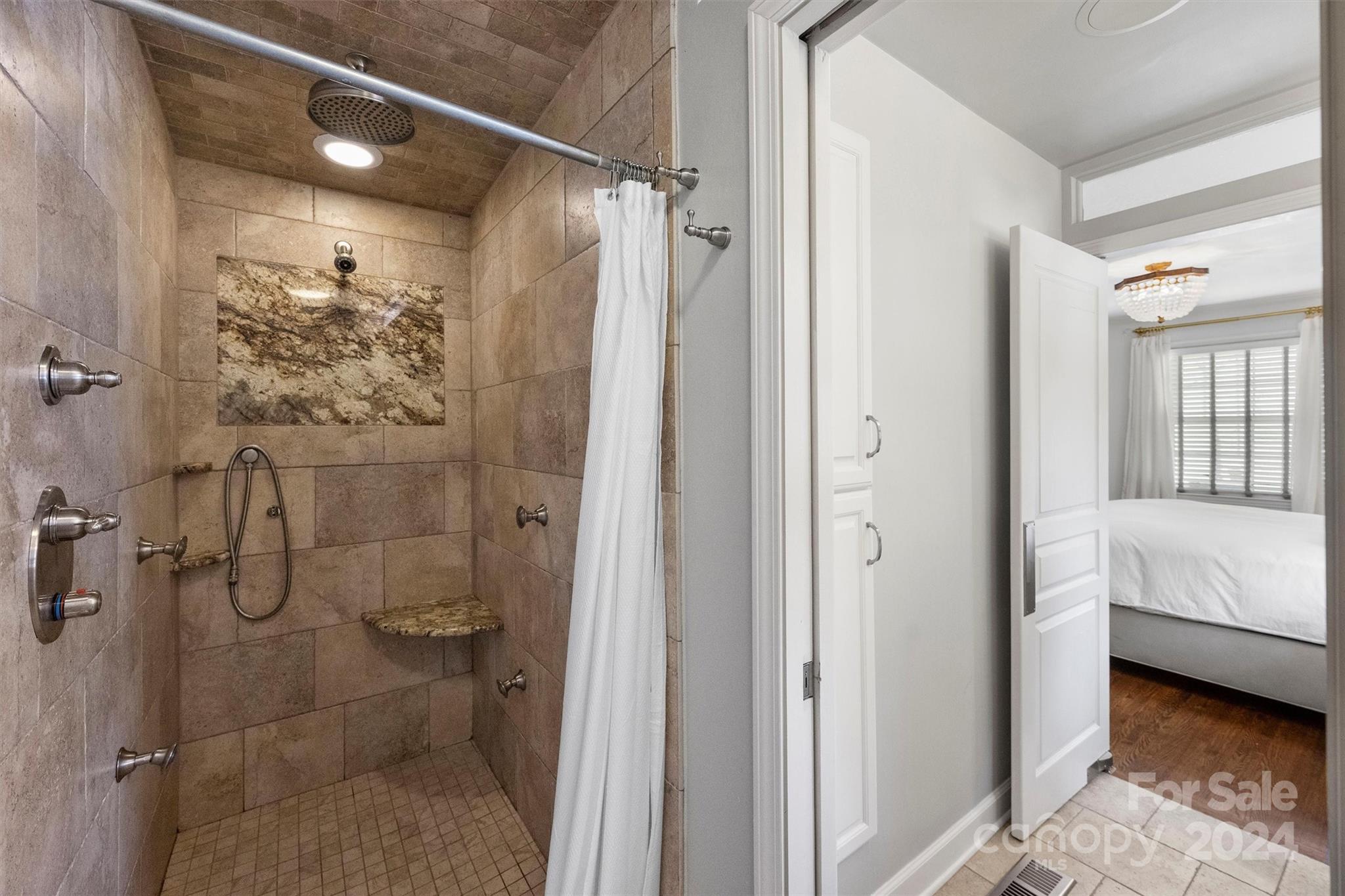 4115 Sulkirk Road Charlotte, NC 28210 - Photo 25 of 39 a bathroom with a shower and a toilet