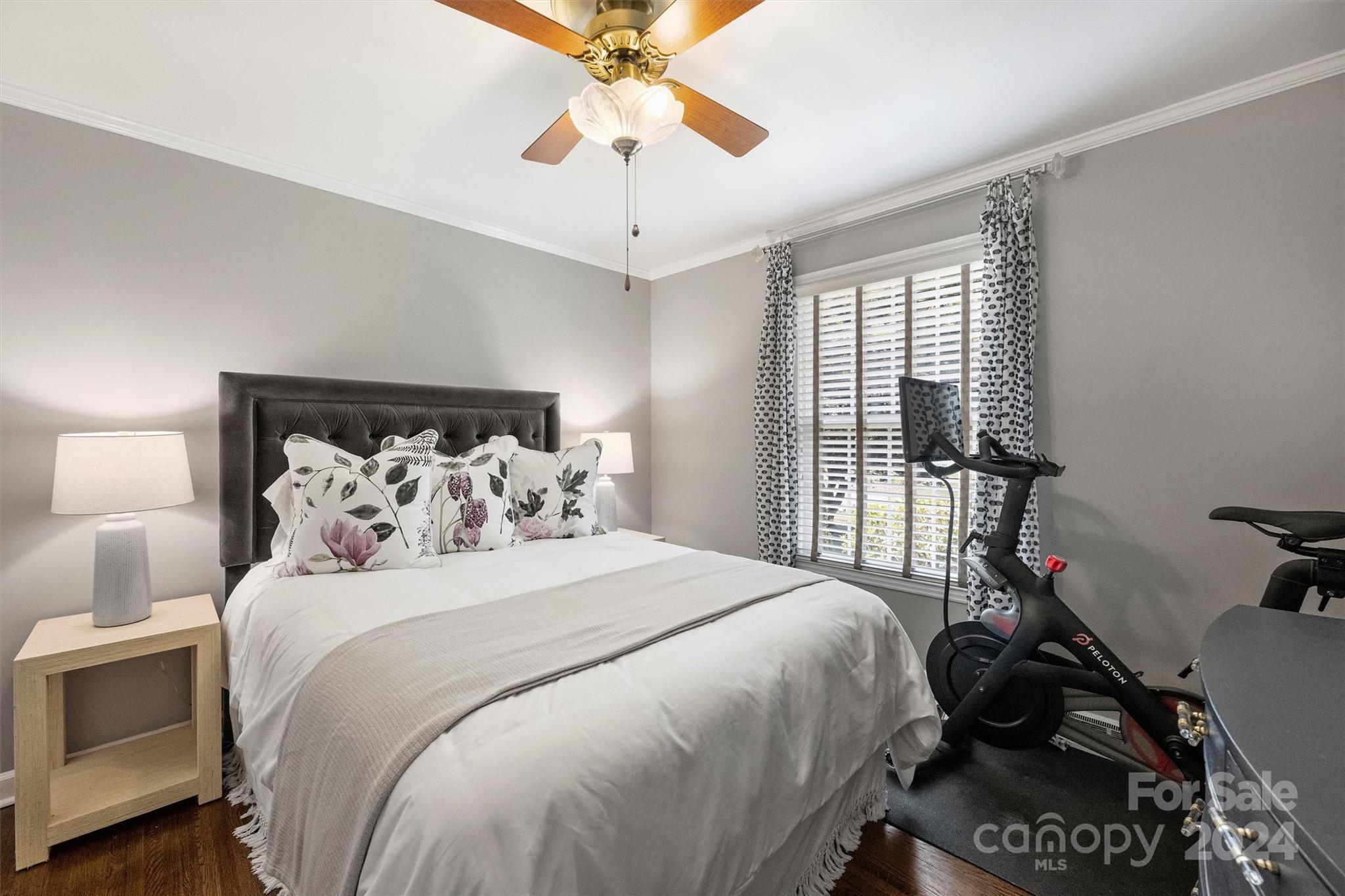 4115 Sulkirk Road Charlotte, NC 28210 - Photo 26 of 39 a bedroom with a bed and a chandelier